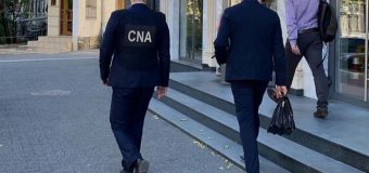 Biroul unui consultant al Secției Licențiere din cadrul ANRE, percheziționat de ofițerii CNA într-un dosar de corupție